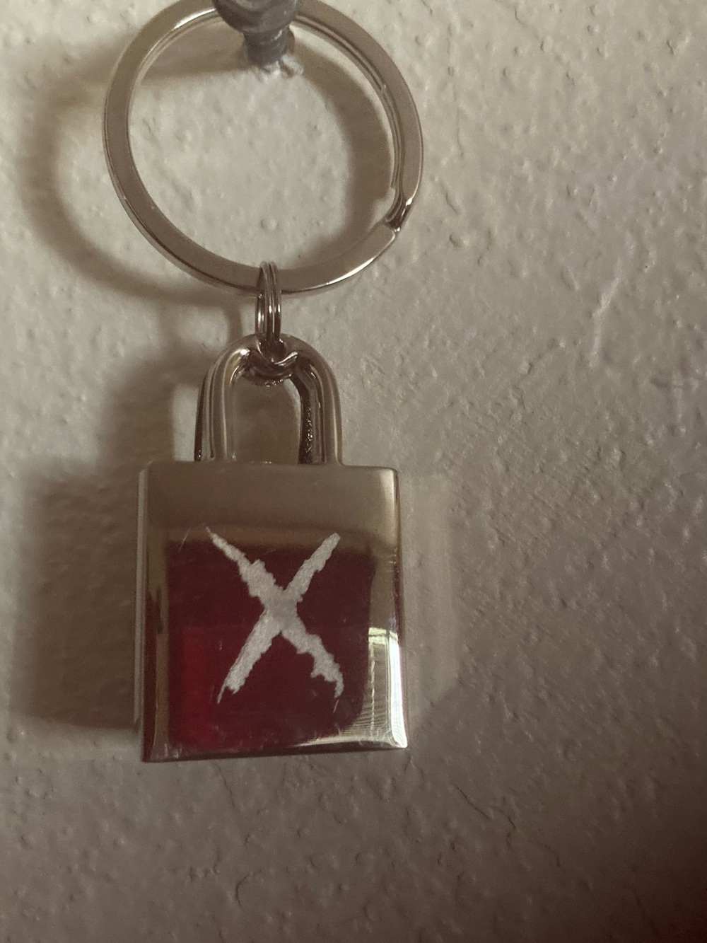 Silver Padlock Keychain with White 'X' and Red Accent